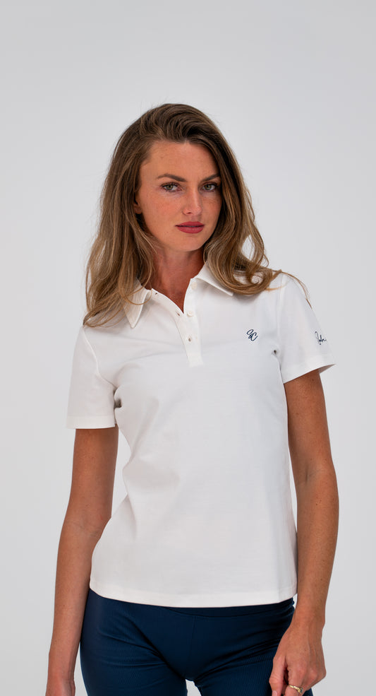 Model wearing Le Classique Polo Women in white, front view