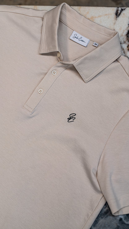 Le Classique Polo in cream, close-up of collar and chest monogram