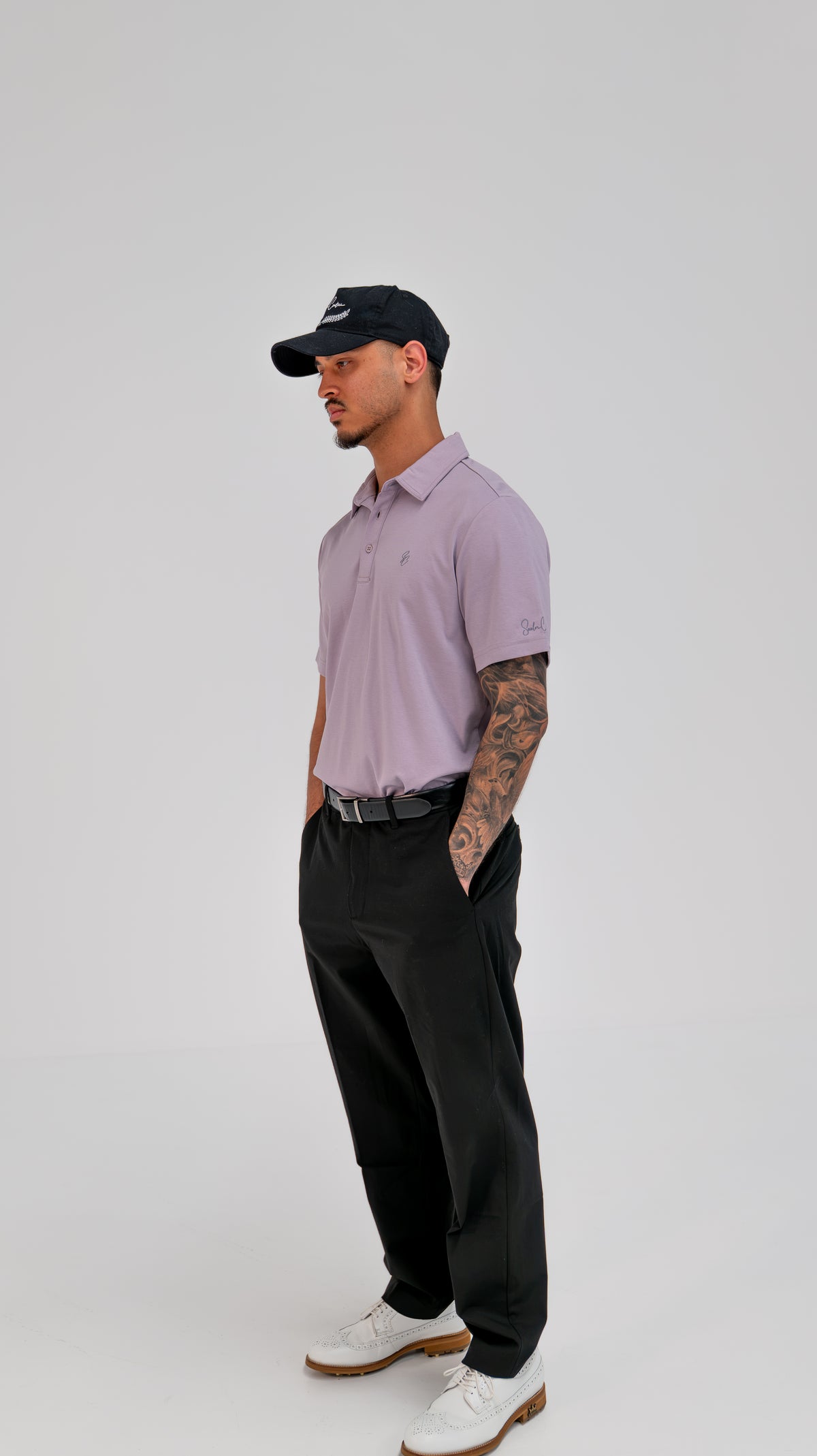 Le Classique Polo in lilac styled with black trousers, full-length view