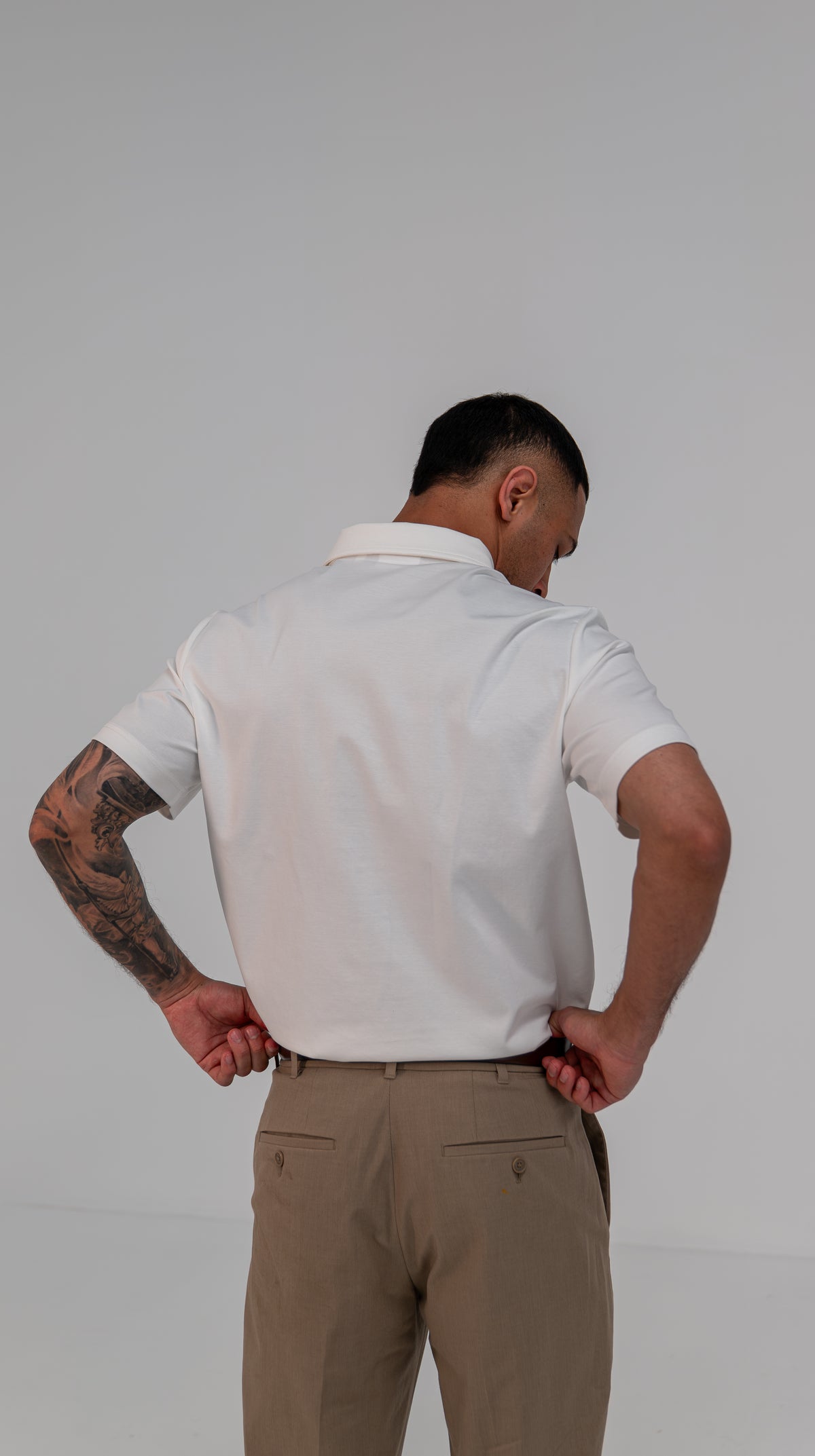 Le Classique Polo in white, worn on model, back view